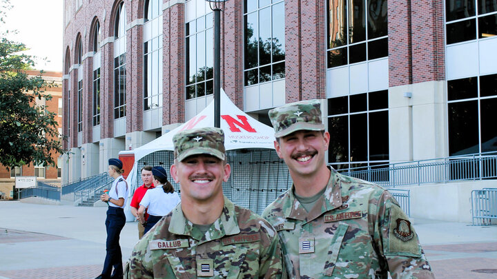 Two Air Force ROTC cadets standing in front of Memorial Stadium in Lincoln, NE