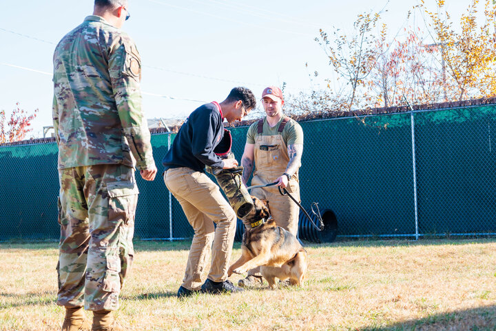 Cadet from UNL AFROTC with Offutt Dog Trainer